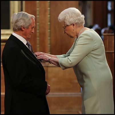 Bob Woodward receives his OBE from Her Majesty The Queen